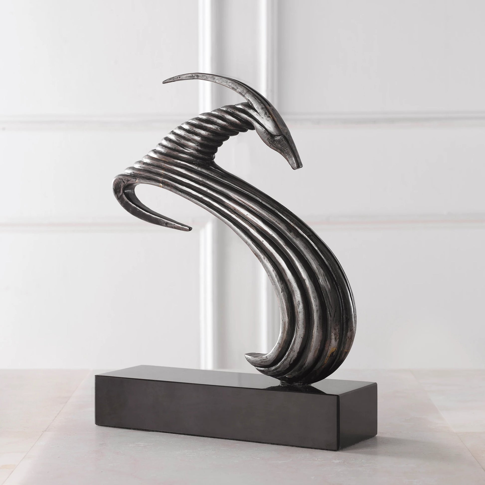 Take the Lead Sculpture by Uttermost in aged silver. Made from iron, marble in a modern style.