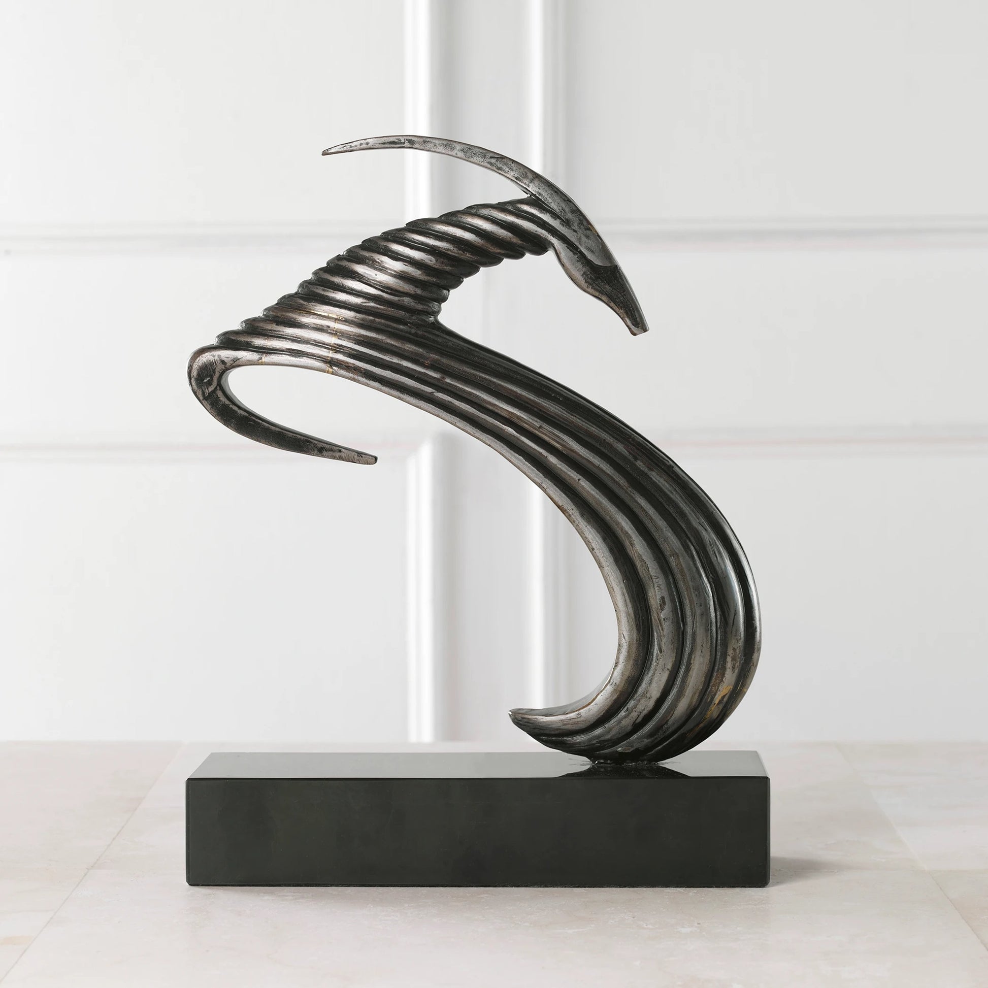 Take the Lead Sculpture by Uttermost in aged silver. Made from iron, marble in a modern style.