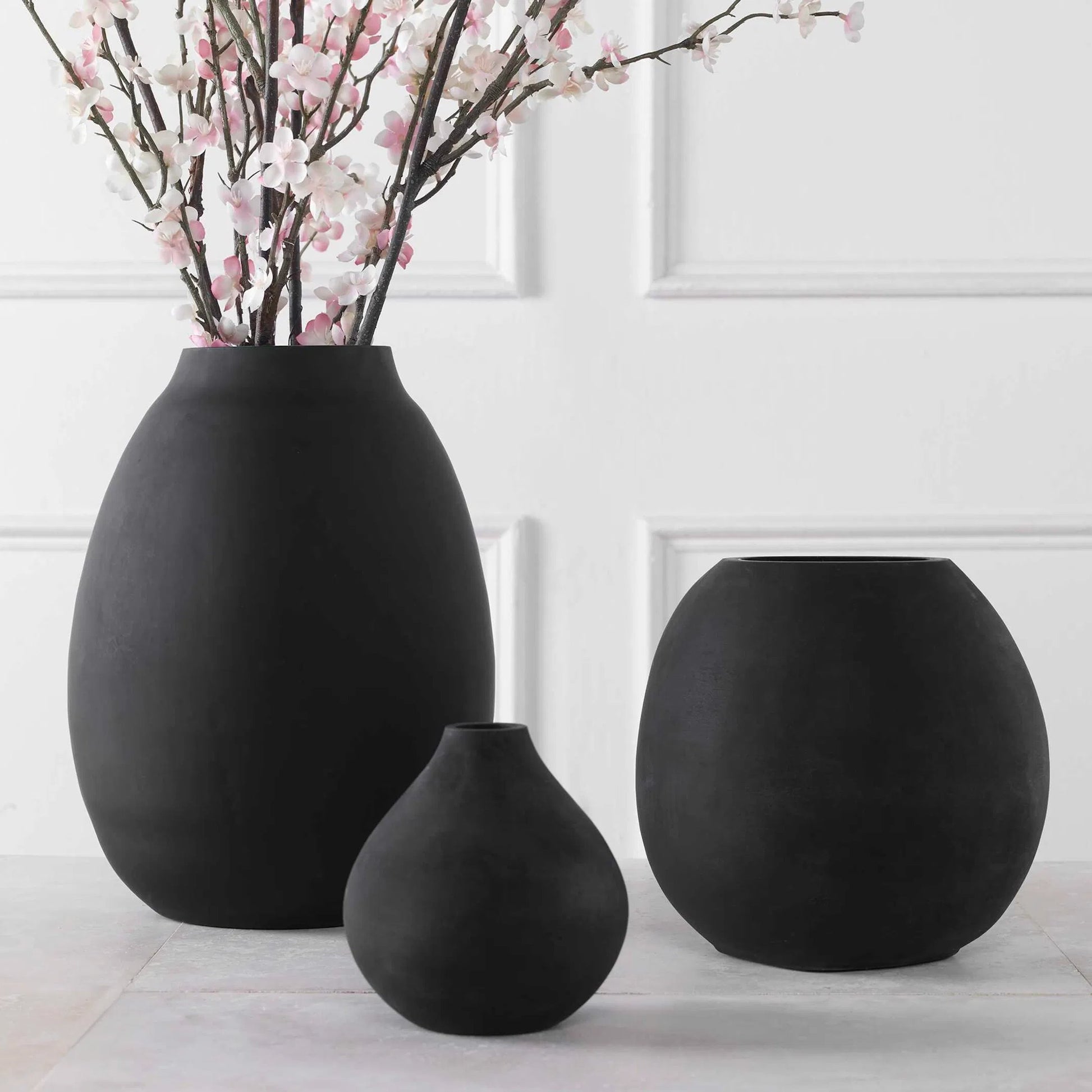 Hearth Vases by Uttermost in matte black. Made from glass in a modern style.