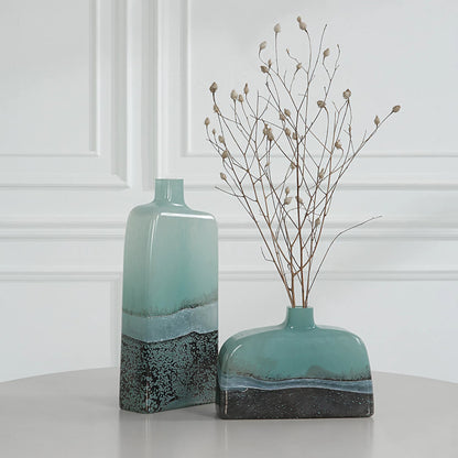 Fuze Vases by Uttermost in aqua, bronze. Made from glass in a modern style.
