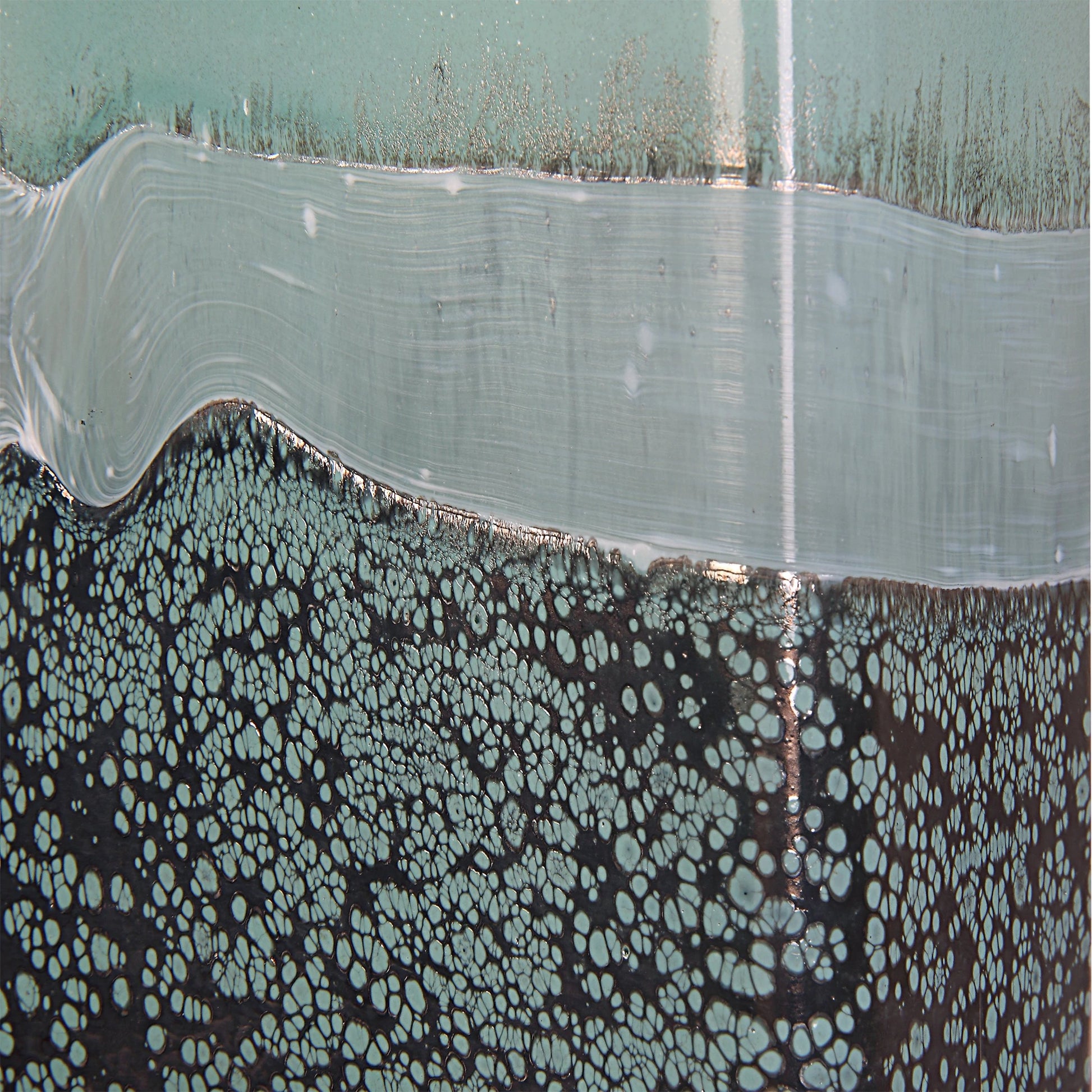 Fuze Vases by Uttermost in aqua, bronze. Made from glass in a modern style.