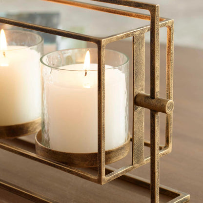 Wenman Triple Candleholder by Uttermost in gold. Made from glass, iron in a unique style.