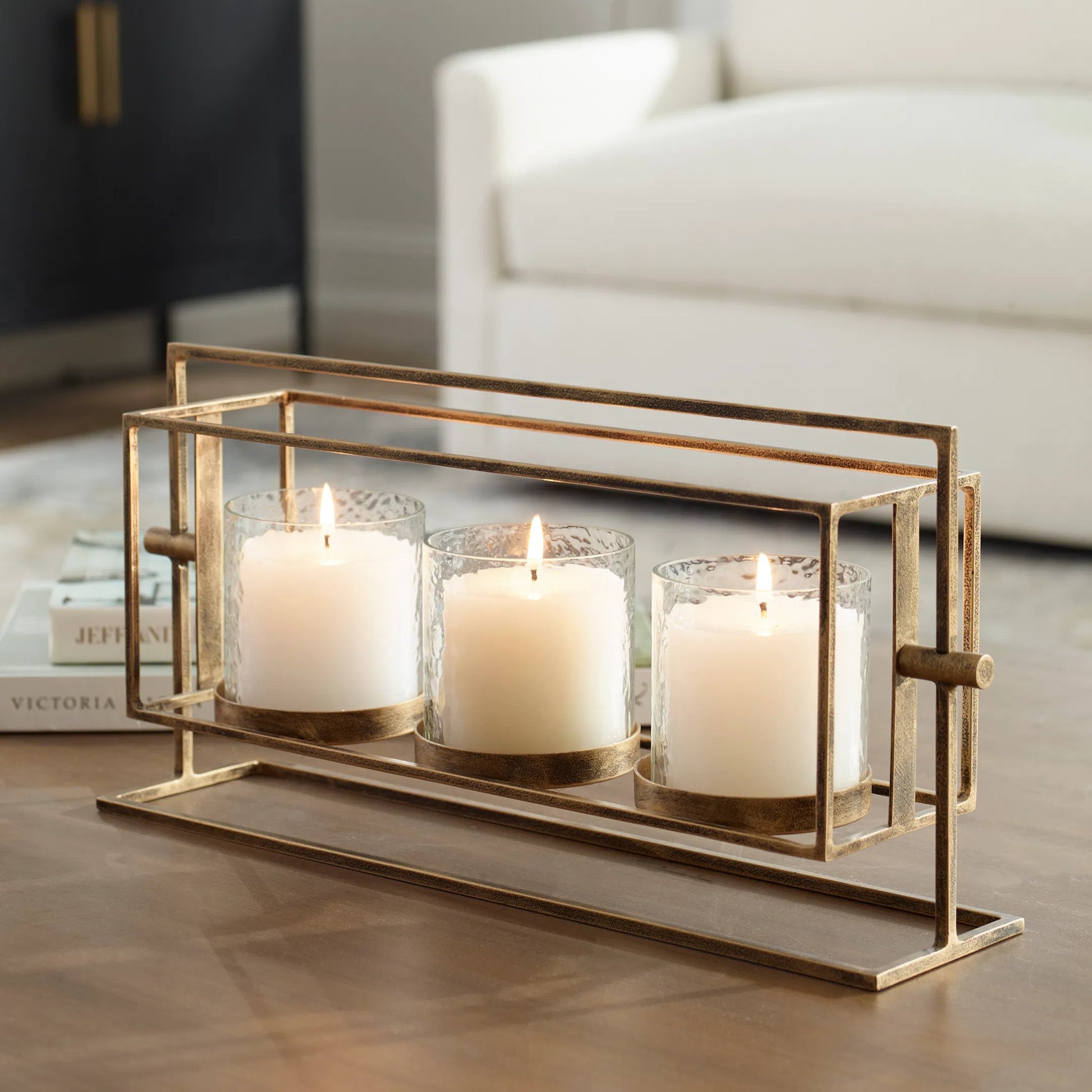 Wenman Triple Candleholder by Uttermost in gold. Made from glass, iron in a unique style.