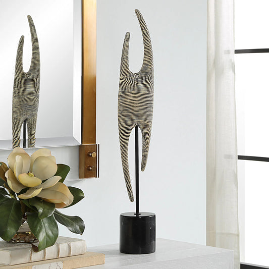 Pochette Ribbed Sculpture by Uttermost in iron. Made from resin, steel, gx black marble in a modern style.