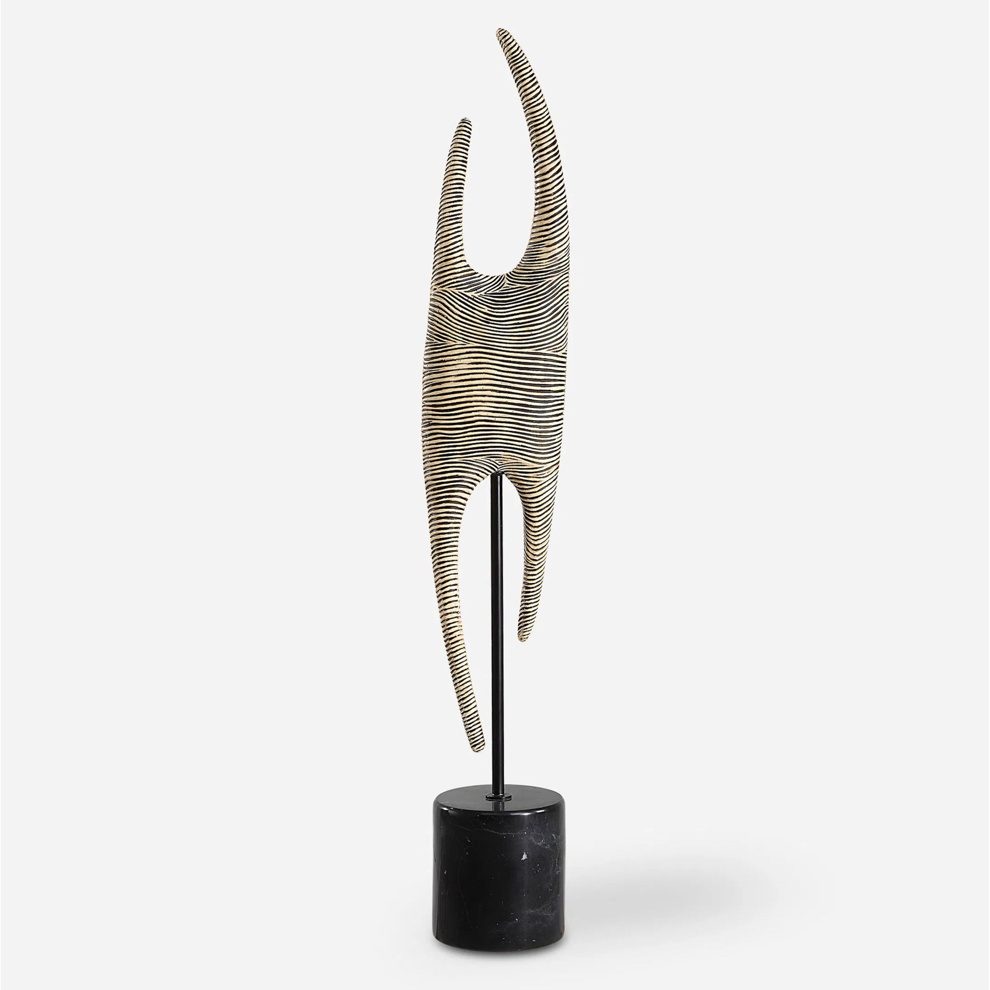 Pochette Ribbed Sculpture by Uttermost in iron. Made from resin, steel, gx black marble in a modern style.