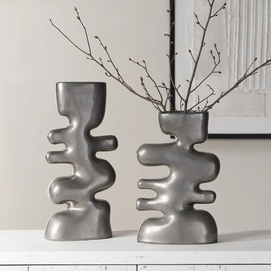 Free Flowing Vases by Uttermost in nickel. Made from ceramic in a unique style.
