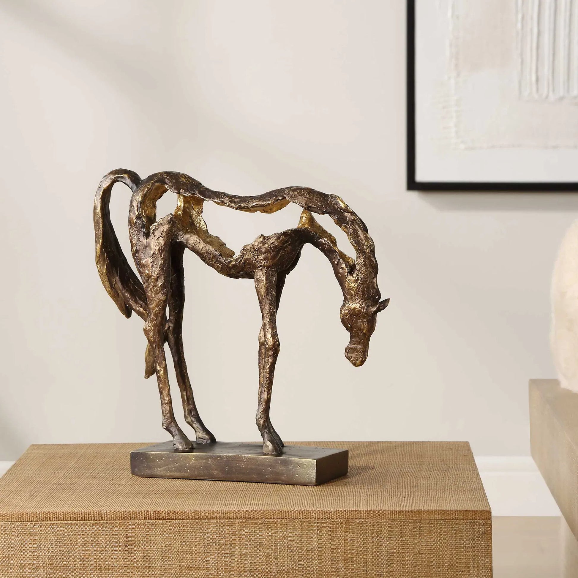 Openly Grazing Horse Sculpture by Uttermost in antique bronze. Made from polyresin in a unique style.