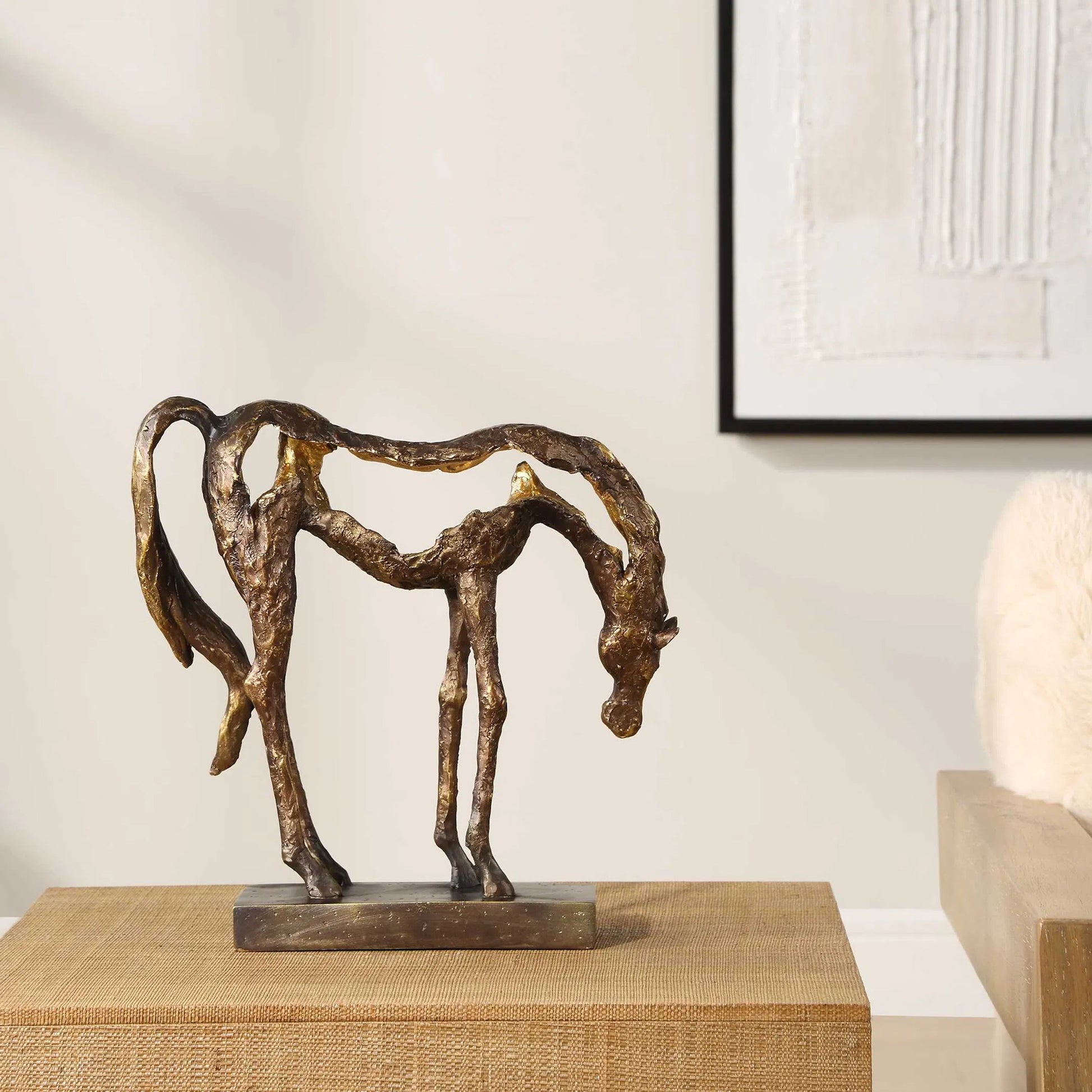 Openly Grazing Horse Sculpture by Uttermost in antique bronze. Made from polyresin in a unique style.