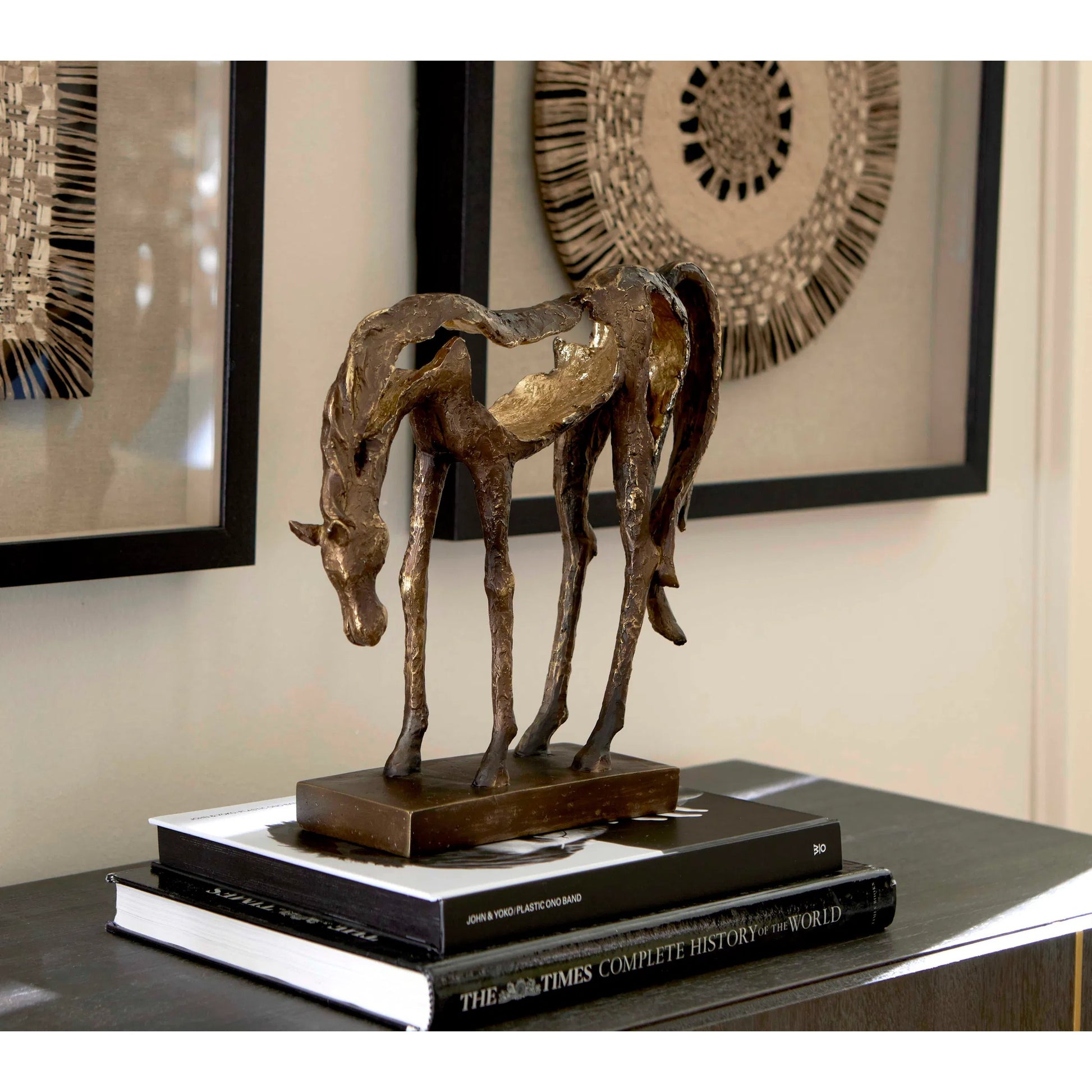 Openly Grazing Horse Sculpture by Uttermost in antique bronze. Made from polyresin in a unique style.