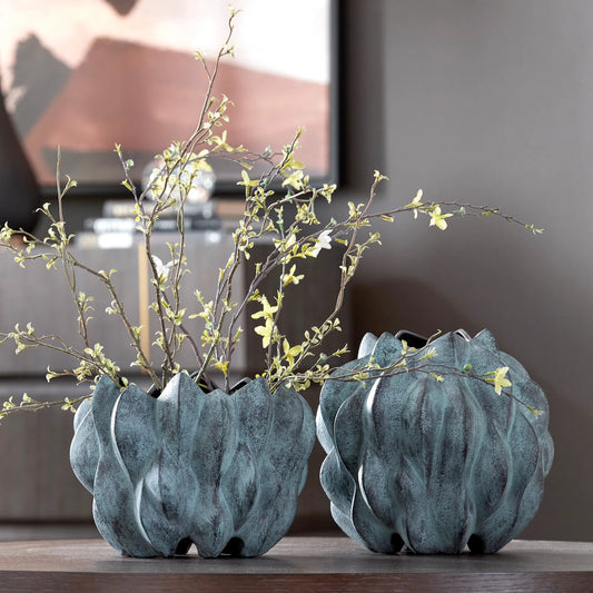 Verdant Vases by Uttermost in bronze. Made from ceramic in a unique style.