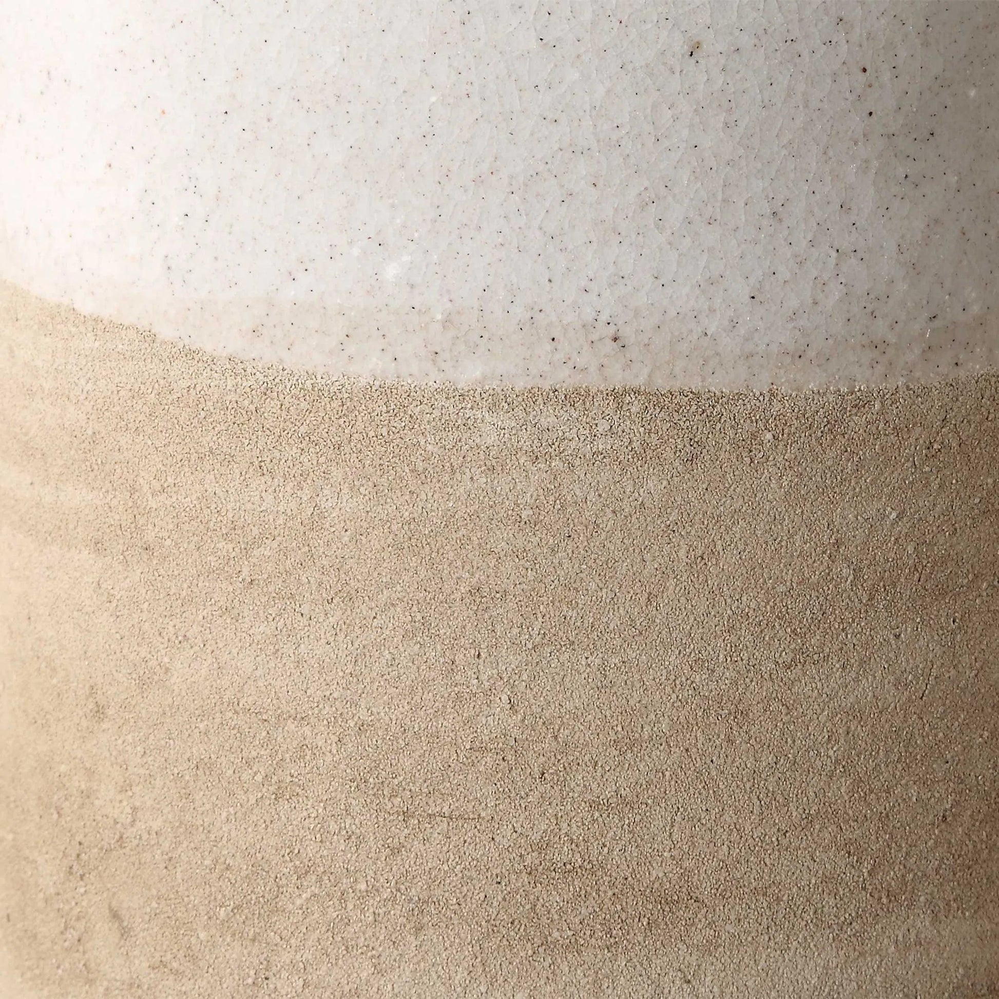 Sands Ceramic Vases by Uttermost in white. Made from ceramic in a unique style.