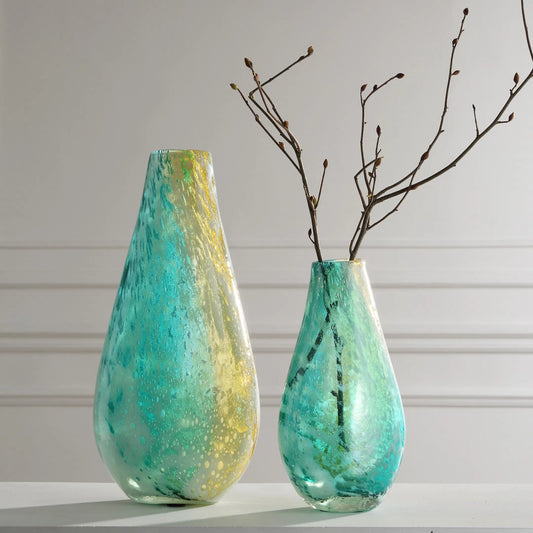 High Tide Glass Vases by Uttermost in gold. Made from glass in a unique style.