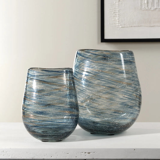 Aurora Swirl Glass Vases by Uttermost in gold. Made from glass in a unique style.
