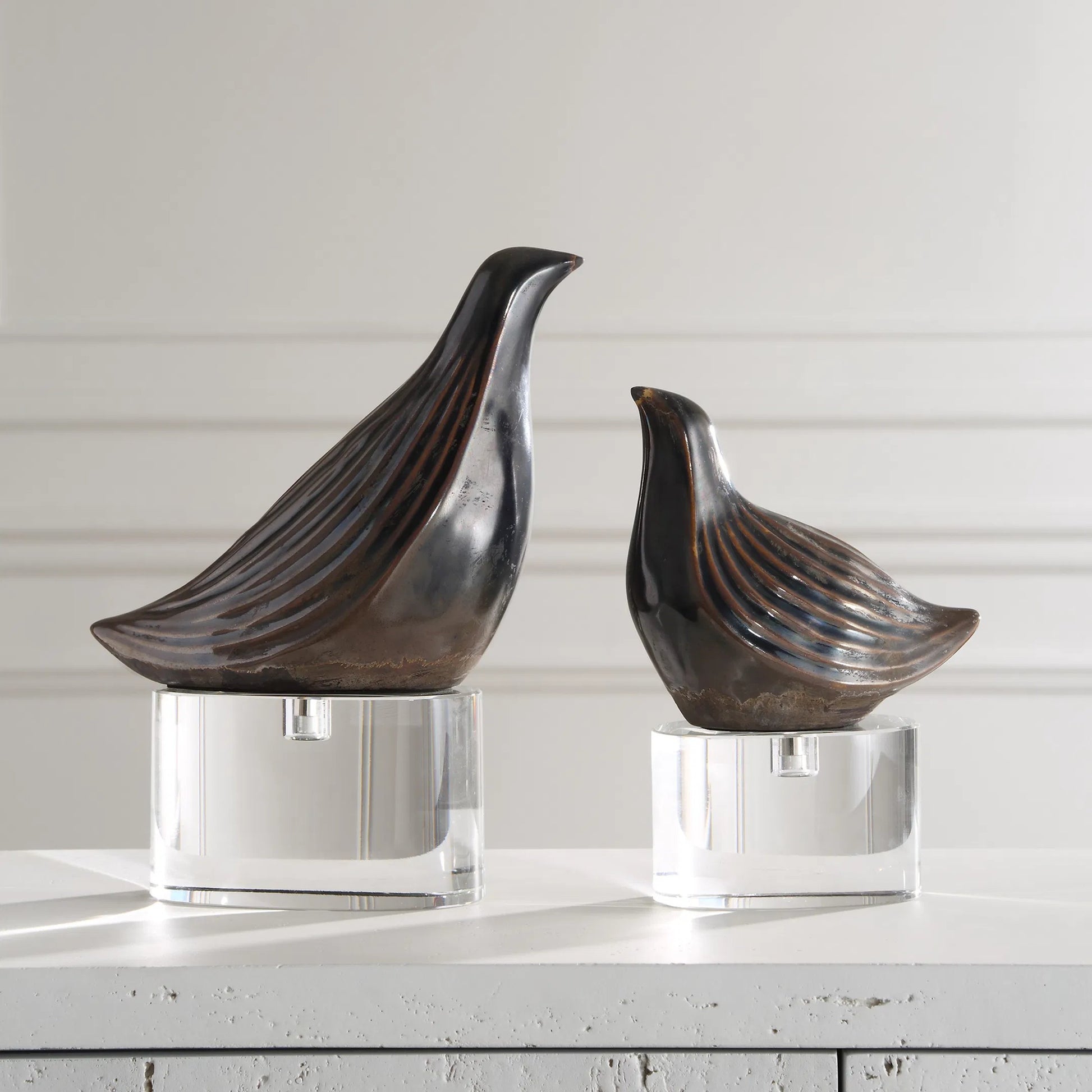 Nesting Bird Sculptures by Uttermost in gray. Made from crystal, ceramic in a cottage & farmhouse style.