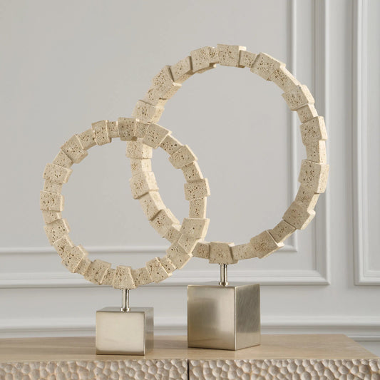 Fusion Rings by Uttermost in nickel. Made from steel, faxu travertine resin in a transitional style.