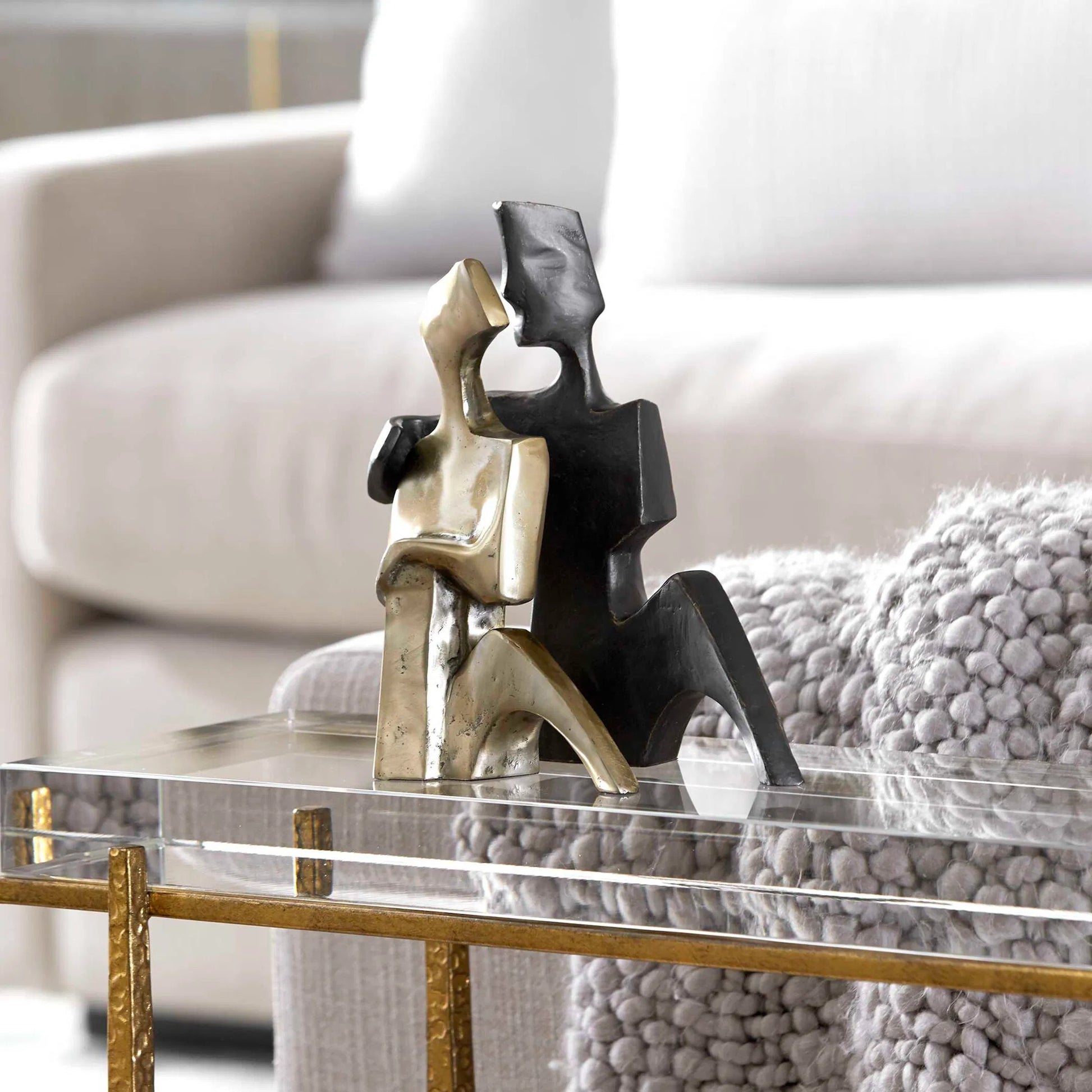 Affection Sculpture by Uttermost in gold. Made from cast iron in a eclectic & global style.