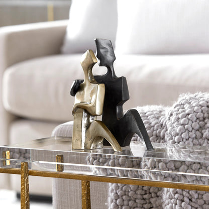 Affection Sculpture by Uttermost in gold. Made from cast iron in a eclectic & global style.