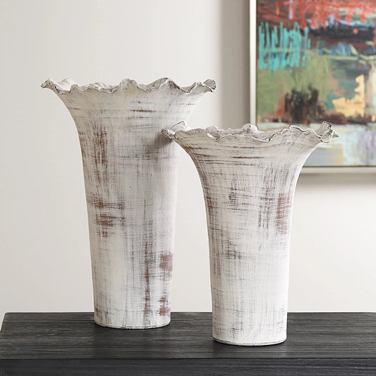 Ruffled Petal Vases by Uttermost in rust. Made from porcelain in a unique style.