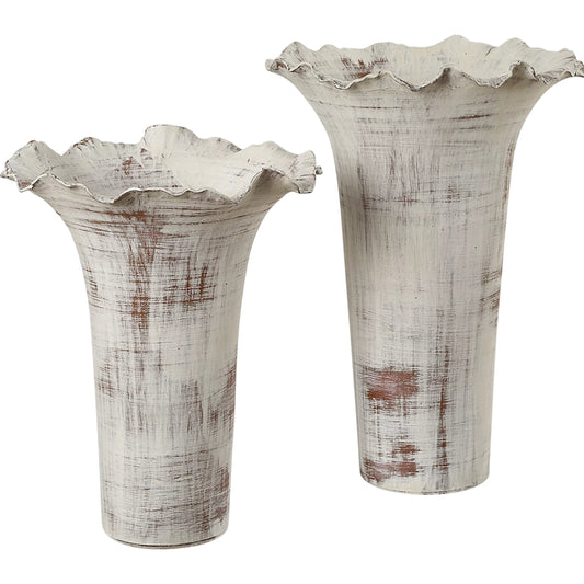 Ruffled Petal Vases by Uttermost in rust. Made from porcelain in a unique style.