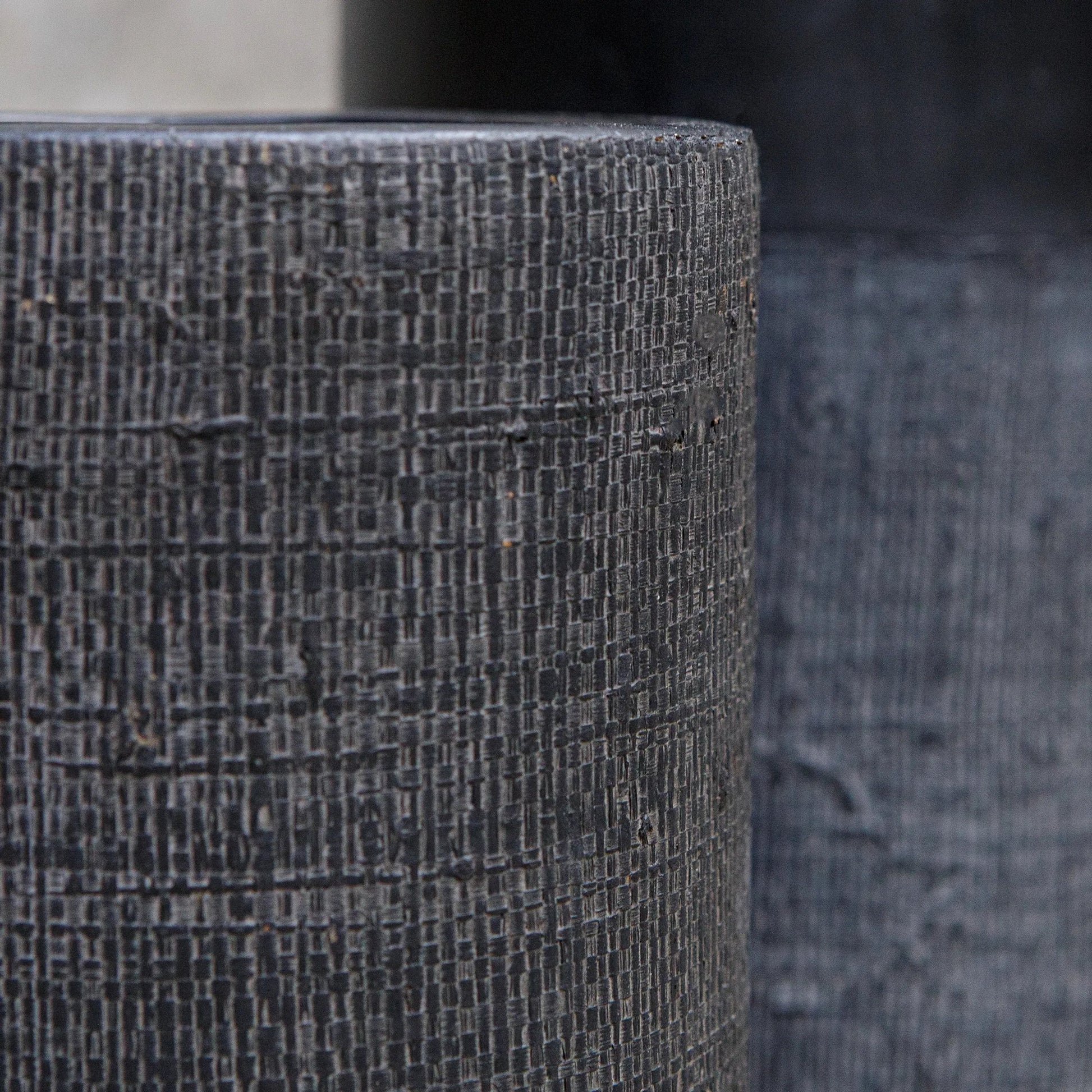 Woven Shadow Vases by Uttermost in black. Made from terracota, weave sisal fibers in a transitional style.