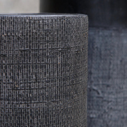 Woven Shadow Vases by Uttermost in black. Made from terracota, weave sisal fibers in a transitional style.