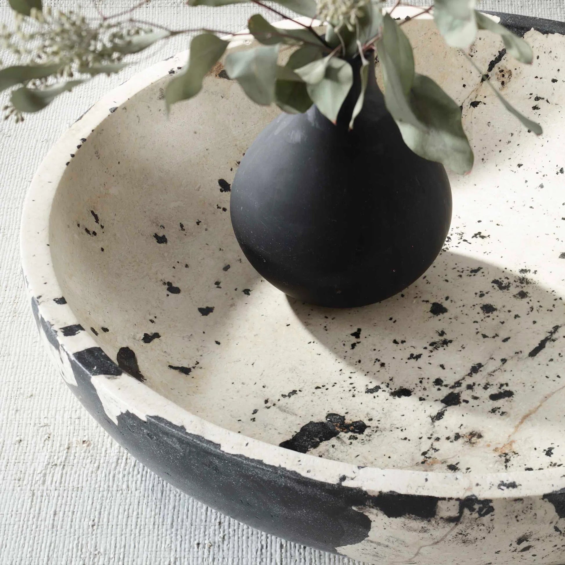Nouveau Limestone Bowl by Uttermost in black. Made from lime stone, resin in a modern style.