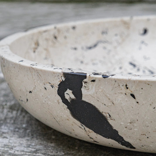 Nouveau Limestone Bowl by Uttermost in black. Made from lime stone, resin in a unique style.
