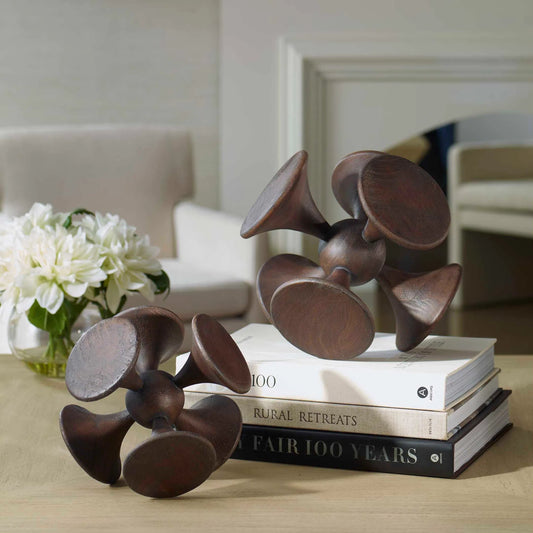 Balanced Harmony Sculptures by Uttermost in dark. Made from suar wood in a traditional style.