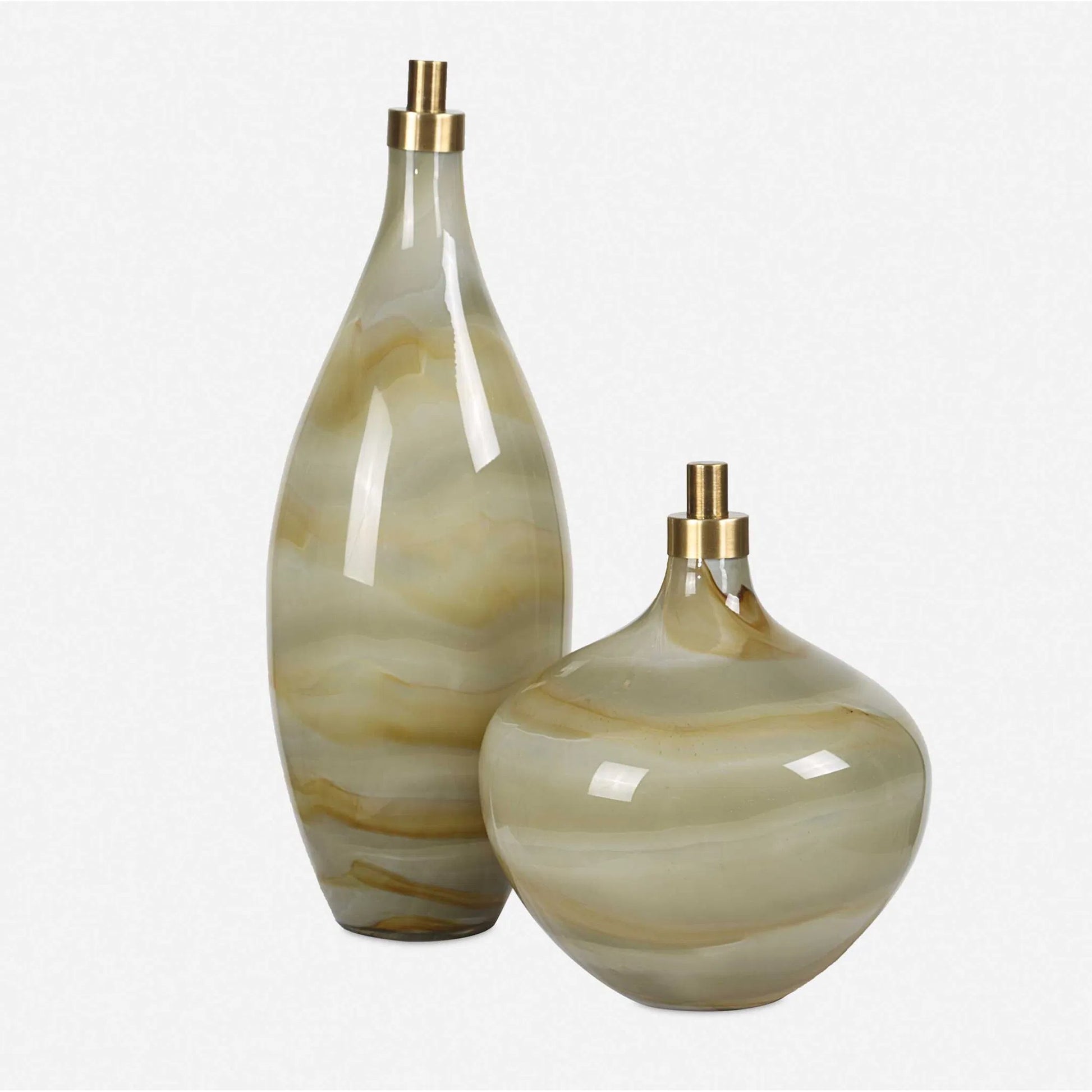 Cascade Glass Bottles by Uttermost in brass. Made from glass, iron in a modern style.