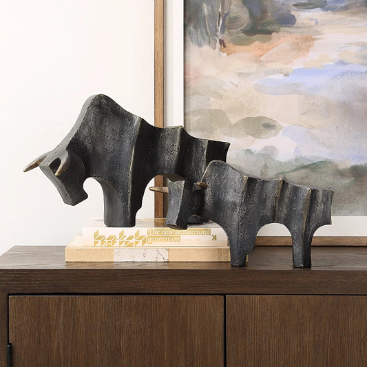 Regal Bull Sculptures by Uttermost in dark bronze. Made from polyresin in a cottage & farmhouse style.