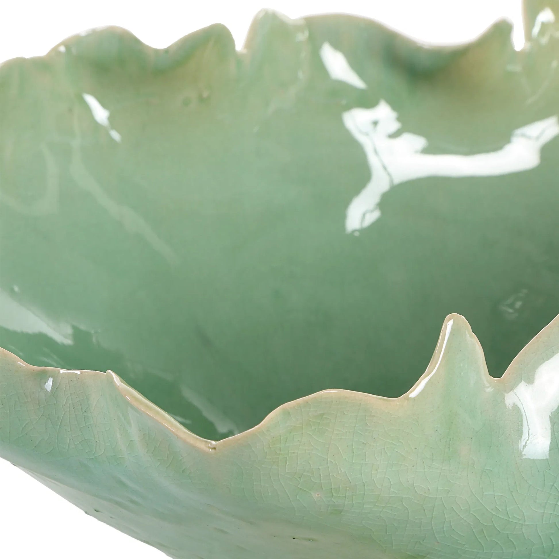Lila Glass Bowl by Uttermost in green. Made from ceramic in a coastal style.