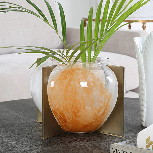 Swirl Vase by Uttermost in brass. Made from glass, iron in a unique style.
