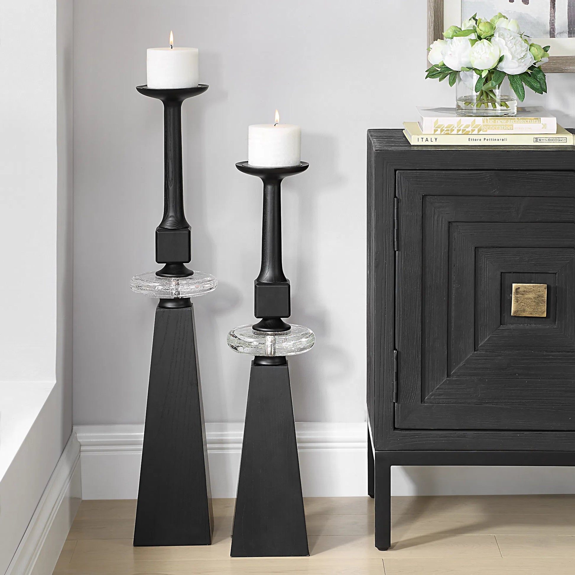 Ebon Glow Floor Candleholders (Set of 2) by Uttermost in black. Made from wood, crystal, metal in a modern style.