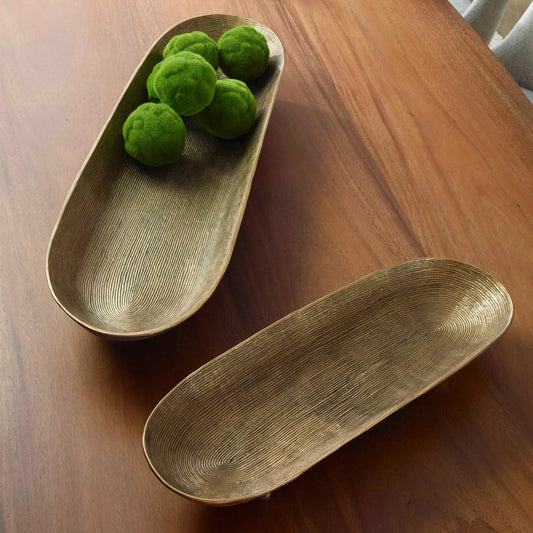 Stratum Oval Bowls by Uttermost in brass. Made from aluminum in a modern style.