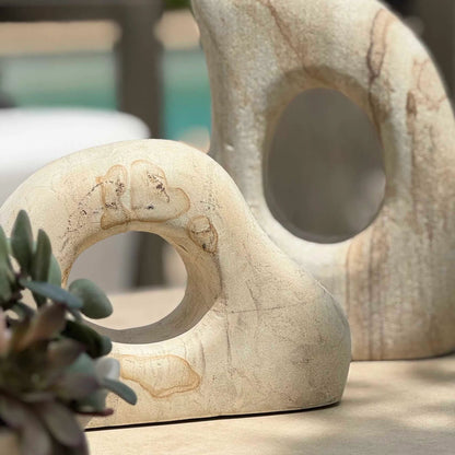 Flow Outdoor Sculptures by Uttermost in stone. Made from palimanan stone in a modern style.