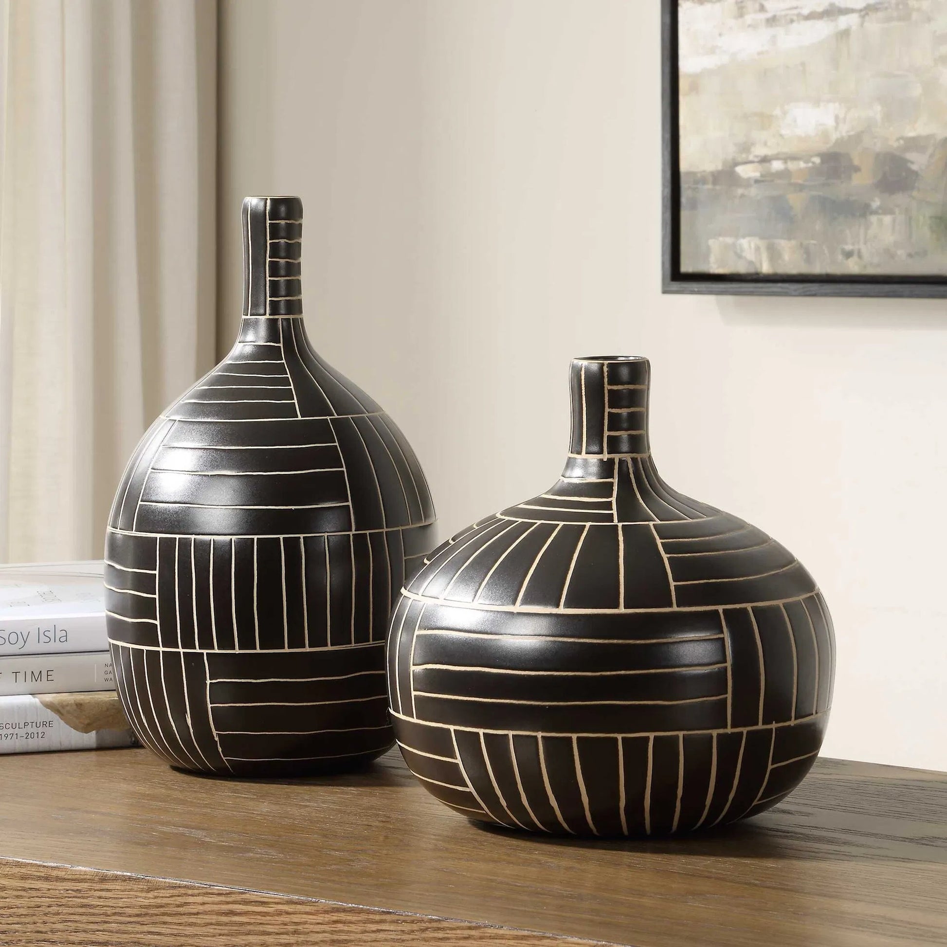 Graphite Stride Geometric Vases by Uttermost in black. Made from ceramic in a unique style.