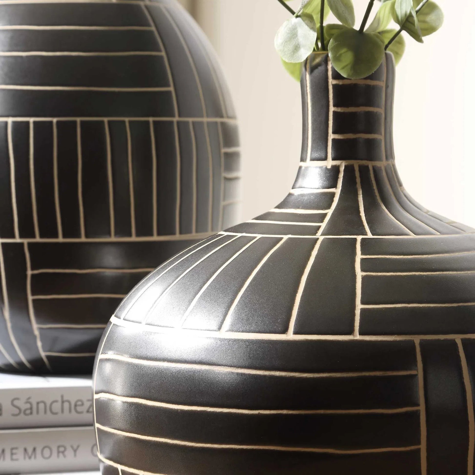 Graphite Stride Geometric Vases by Uttermost in black. Made from ceramic in a unique style.