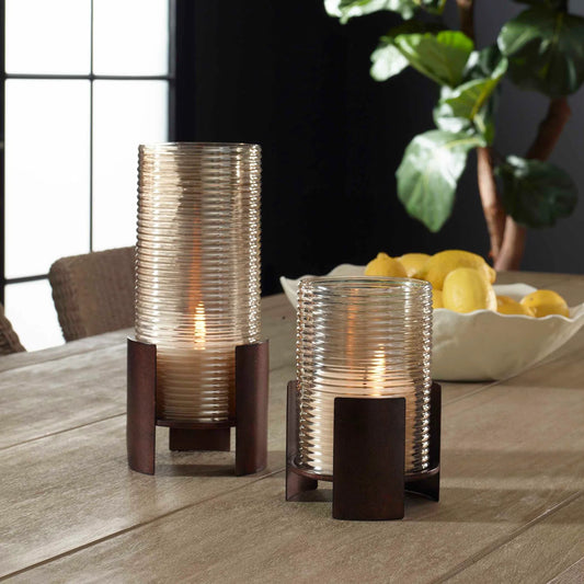 Fluted Fire Cylinder Candleholders by Uttermost in bronze and dark. Made from iron, glass in a unique style.