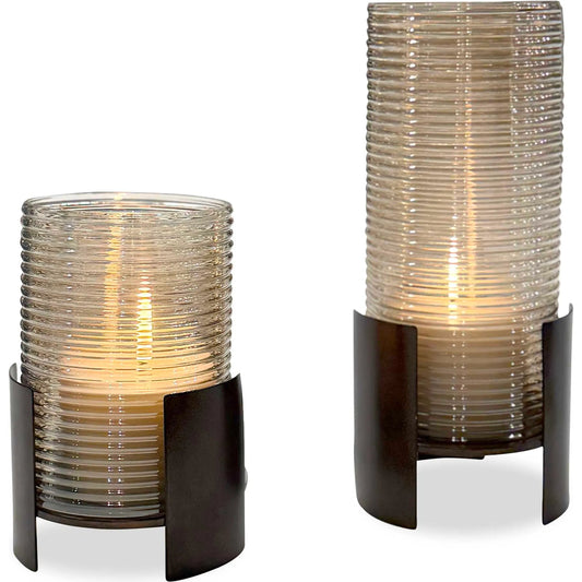 Fluted Fire Cylinder Candleholders by Uttermost in bronze and dark. Made from iron, glass in a unique style.