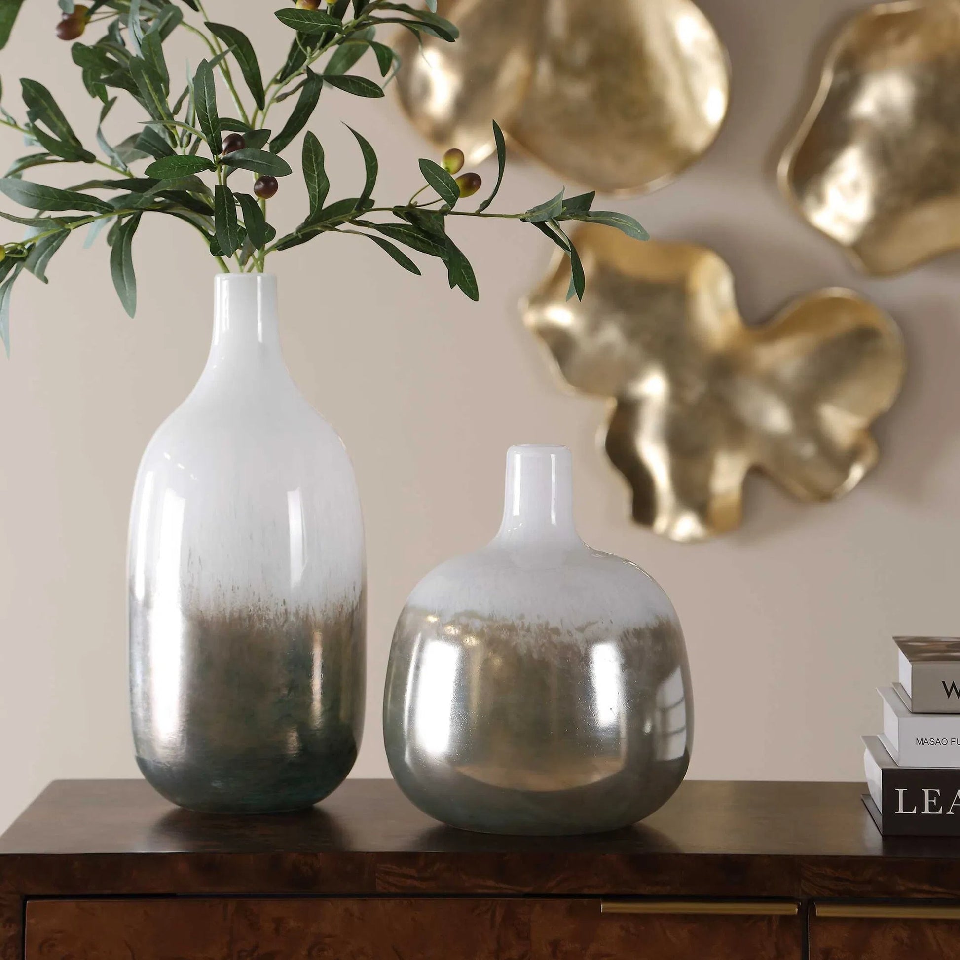 Cardoni Smoke Vases by Uttermost in bronze, white and bronze. Made from glass in a unique style.