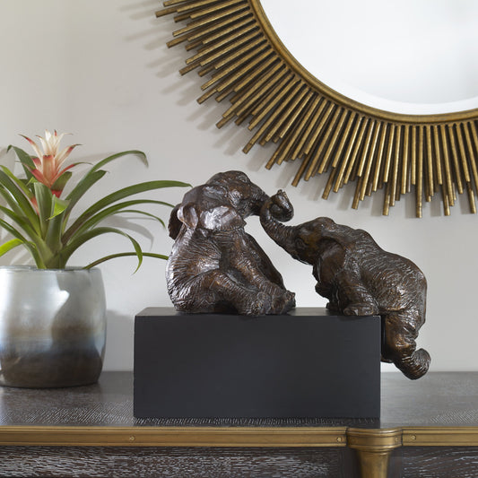 Playful Pachyderms Bronze Figurines by Uttermost in bronze. Made from resin in a eclectic & global style.