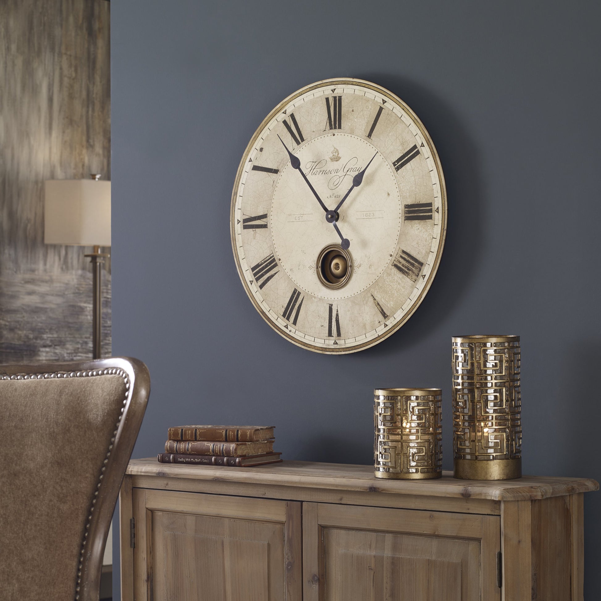 Harrison Clock by Uttermost in gray. Made from mdf, brass, aluminum in a traditional style.