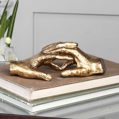 Hold My Hand Sculpture by Uttermost in gold. Made from iron in a modern style.