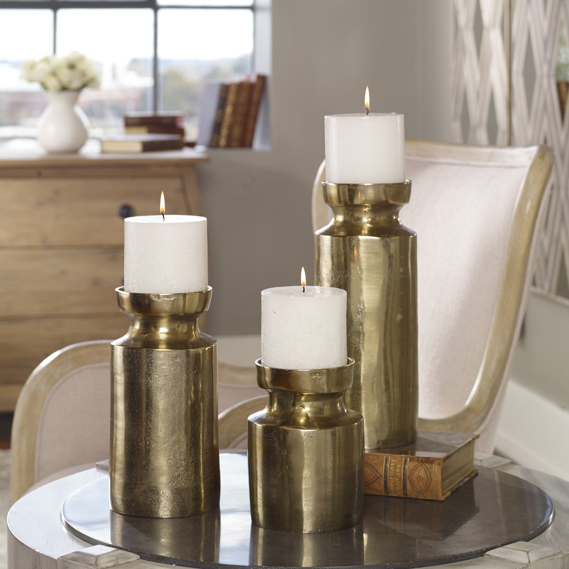 Amina Antique Brass Candleholders by Uttermost. Made from aluminum, wax in a eclectic & global style.
