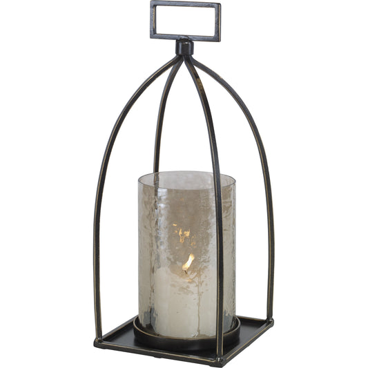 Riad Lantern Candleholder by Uttermost in dark bronze. Made from iron, glass in a rustic style.