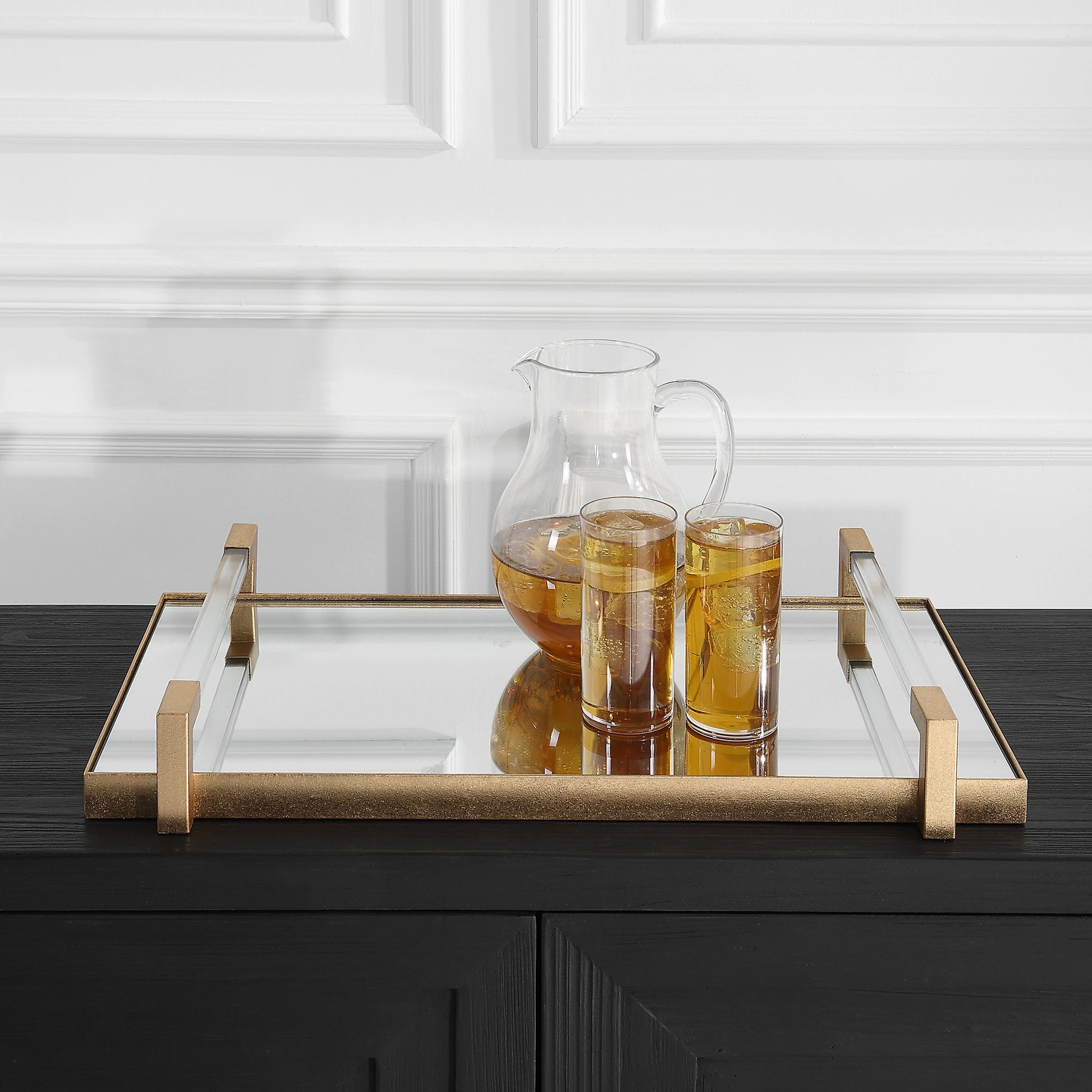 Deki Tray by Uttermost in gold. Made from iron, mirror, acrylic in a modern style.