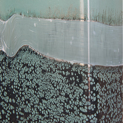 Fuze Vases by Uttermost in aqua, bronze. Made from glass in a modern style.