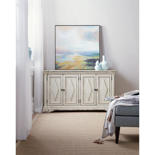 Four Door Cabinet by Hooker Furniture in distressed white. Made from hardwoods in a modern style.