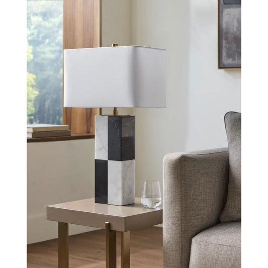 Adornia Lamp- 498952 by Surya in white, black. Made from body: marble, shade (outside): linen, shade (inside): polyester, finial: metal in a modern style.
