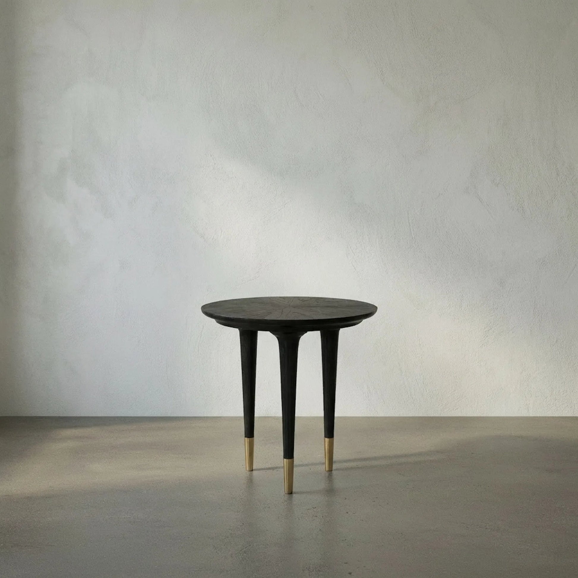 Maganini Side Table by Noir in charcoal black. Made from sungkai and brass caps in a modern style.